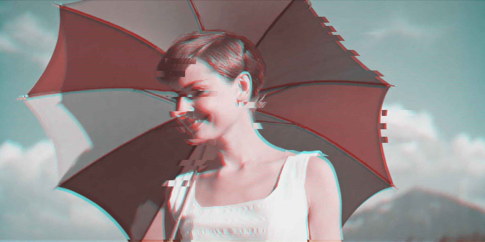 a young woman holding a parasol